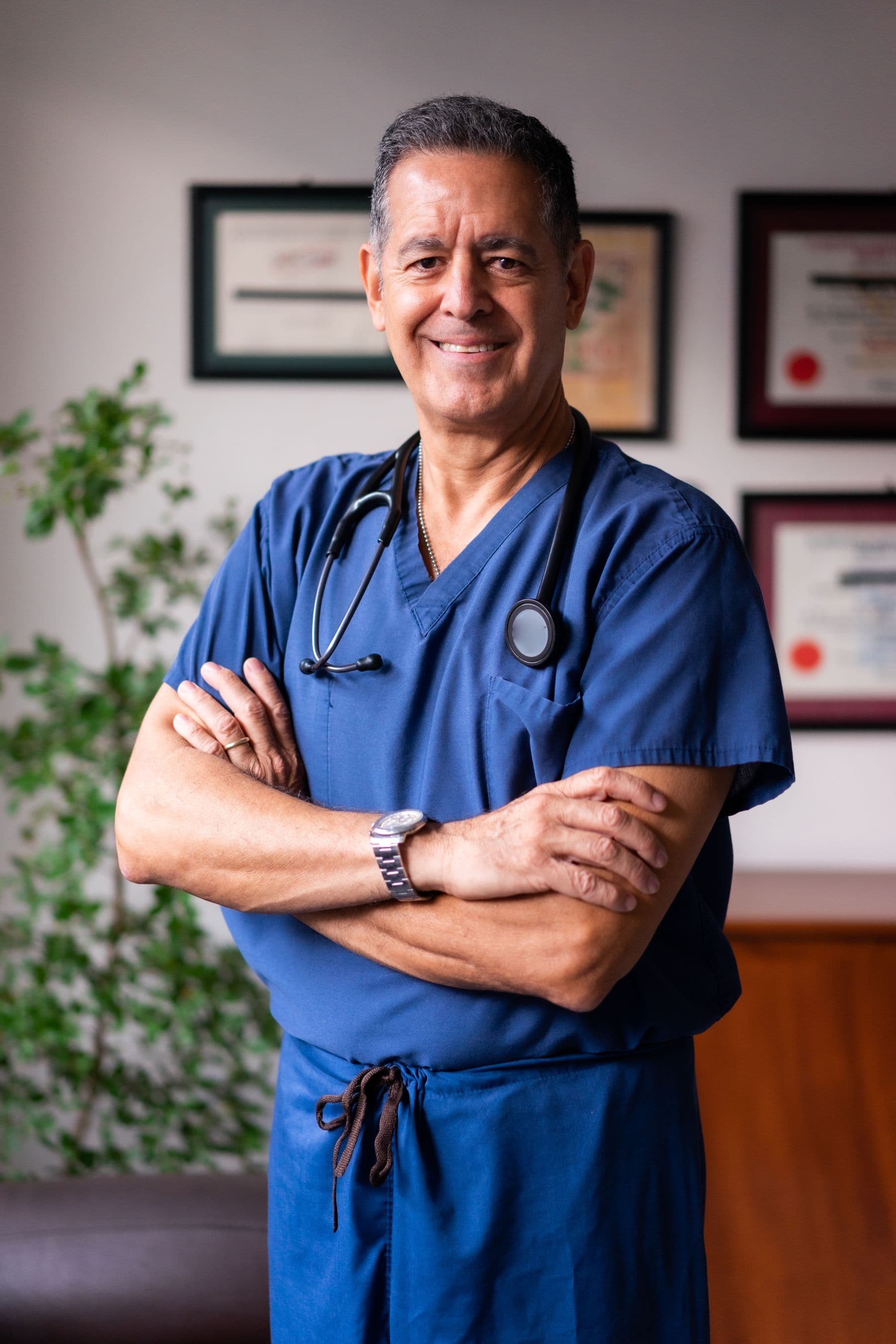 A confident chiropractor in his practice